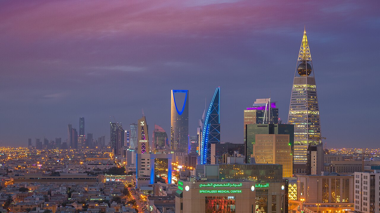 Riyadh skyline at dusk, with Kingdom Centre, Al Faisaliah Tower and illuminated city streets